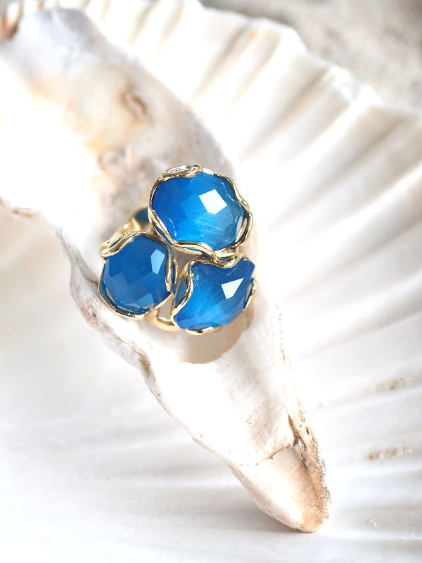 Brass ring met blauwe stenen, flexibele maat
